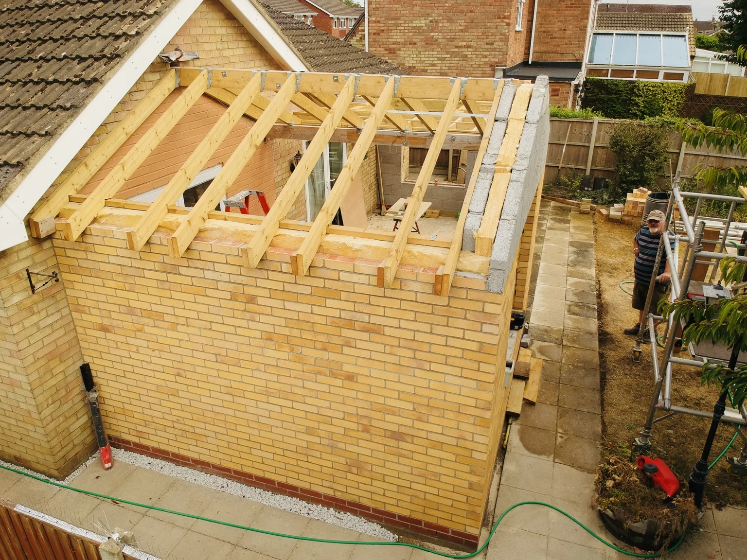 Roof trusses and timbers installed above the extension walls
